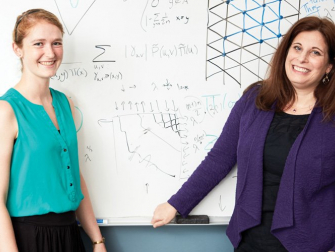Sarah Cannon, Georgia Tech alumna and assistant professor in the Mathematics Department of Mathematical Sciences at Claremont McKenna College, with Dana Randall (Credit: Georgia Tech)